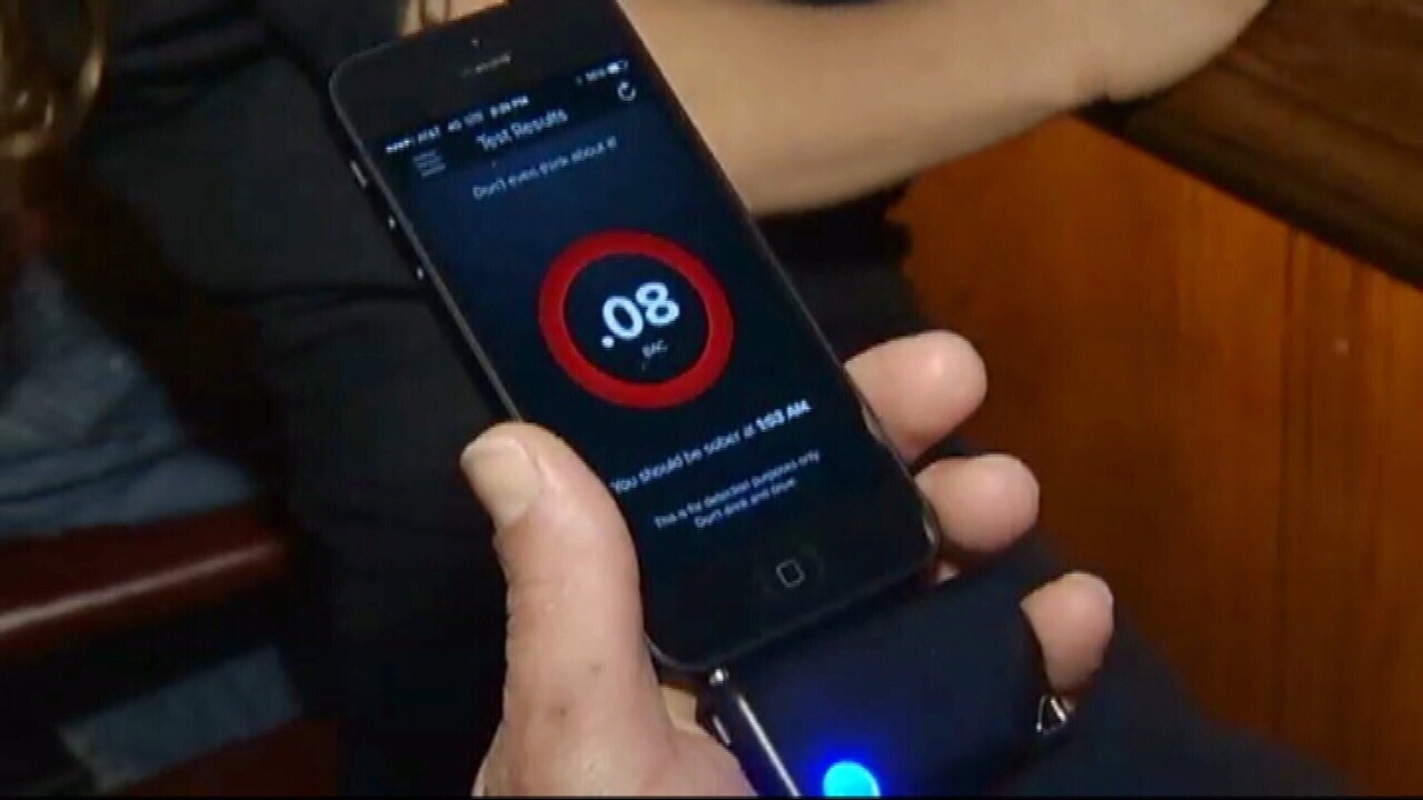 Alcohol breath test plugs into smartphone