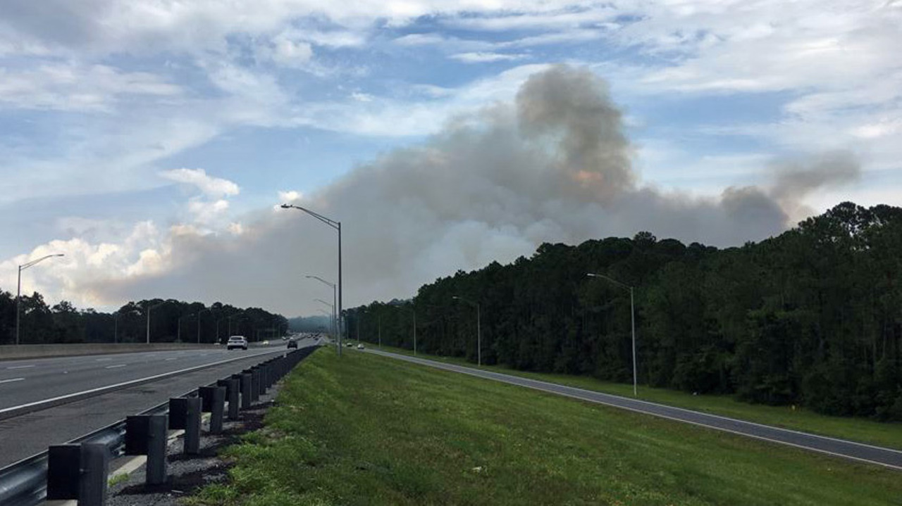 Brush fire in woods near JTB and Hodges Blvd.