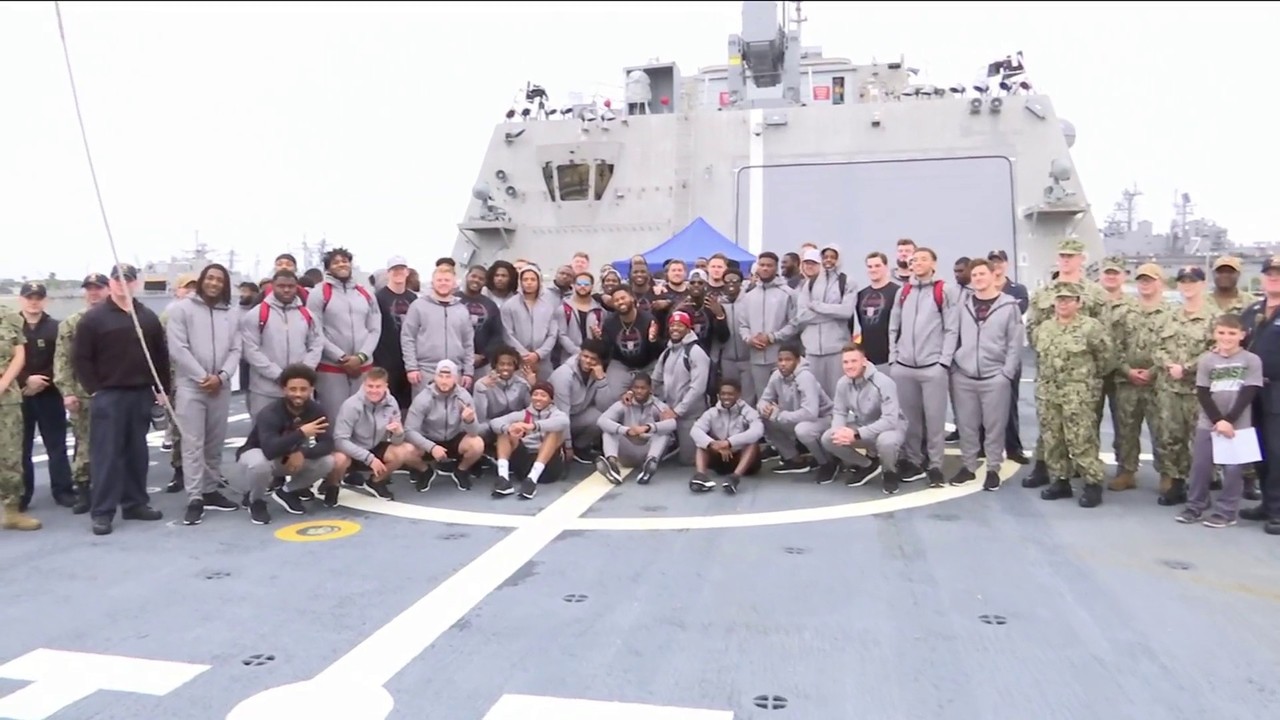 team breaks away from football to get up close look at navy life